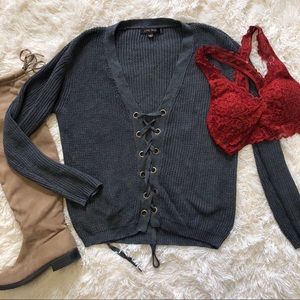 Gray lace up sweater.